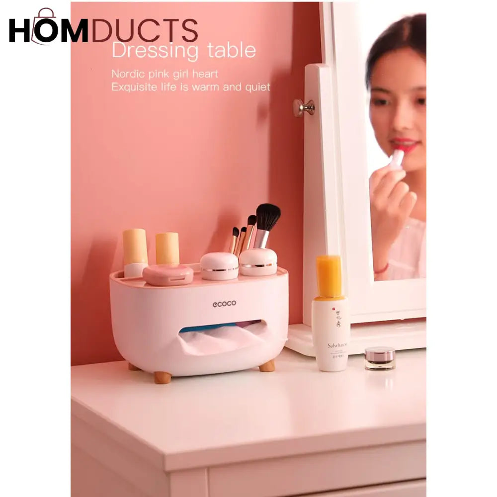 Pink ECOCO tissue box organizer holding cosmetics on a dressing table