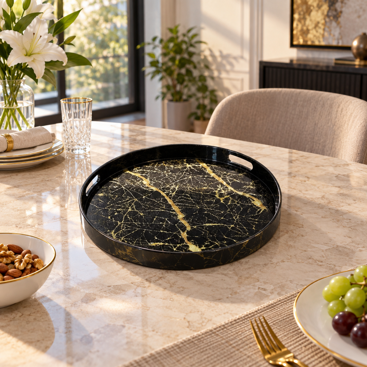 Round black marble-look serving tray with gold veining