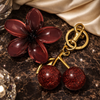 Luxury Sparkling Cherry Keychain – Red Enamel with Gold Detailing