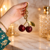 Luxury Sparkling Cherry Keychain – Red Enamel with Gold Detailing
