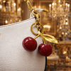 Luxury Sparkling Cherry Keychain – Red Enamel with Gold Detailing