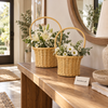 Two round rattan flower baskets with handles