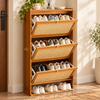 Three open tilt-out compartments filled with organized shoes