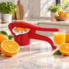 Red manual citrus press juicer