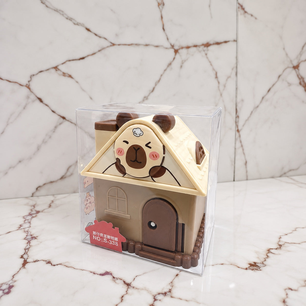 Brown cartoon house money saving box in packaging