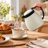 Danny Home Compact 500ml White Vacuum Jug serving a hot drink