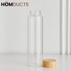 Elegant Cylindrical Glass Bottle with Stylish Wooden Lid - Perfect for Home & Office
