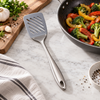 Prestige slotted spatula beside a frying pan