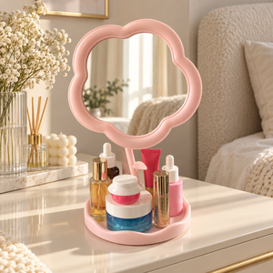 Pink flower-shaped tabletop vanity mirror with cosmetics storage tray