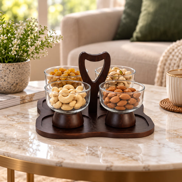 Four glass snack bowls on a dark wooden serving tray