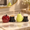 Fruit-shaped toothpick and cotton swab holder shown in apple and pear colours