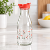 Clear glass refrigerator bottle with flip-top lid