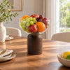 Clear glass serving bowl on a dark wooden pedestal