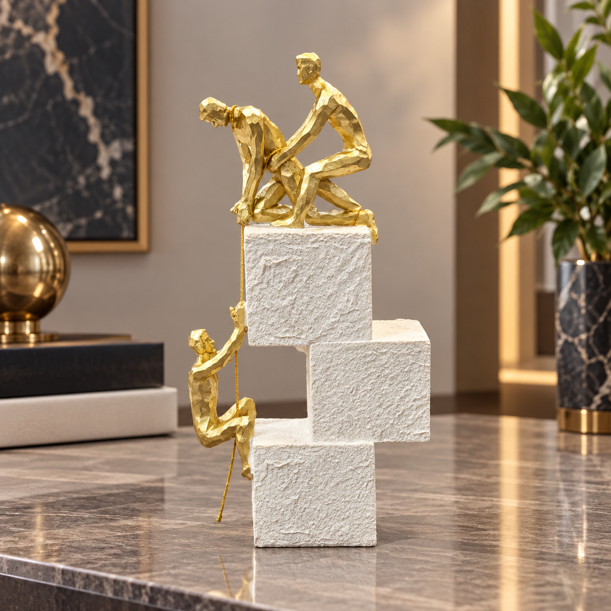 Gold climbing figures motivational achievement sculpture