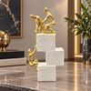 Gold climbing figures motivational achievement sculpture