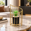 Gold curved cage planter with artificial succulent