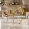 Golden stainless steel flour strainer set in three sizes