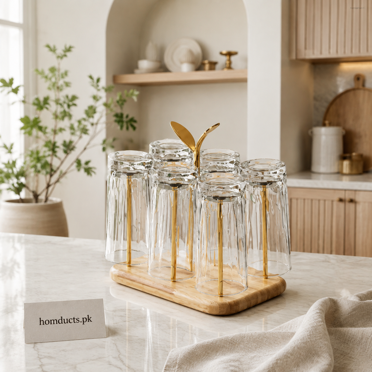 Six clear glasses displayed on a golden holder with wooden base