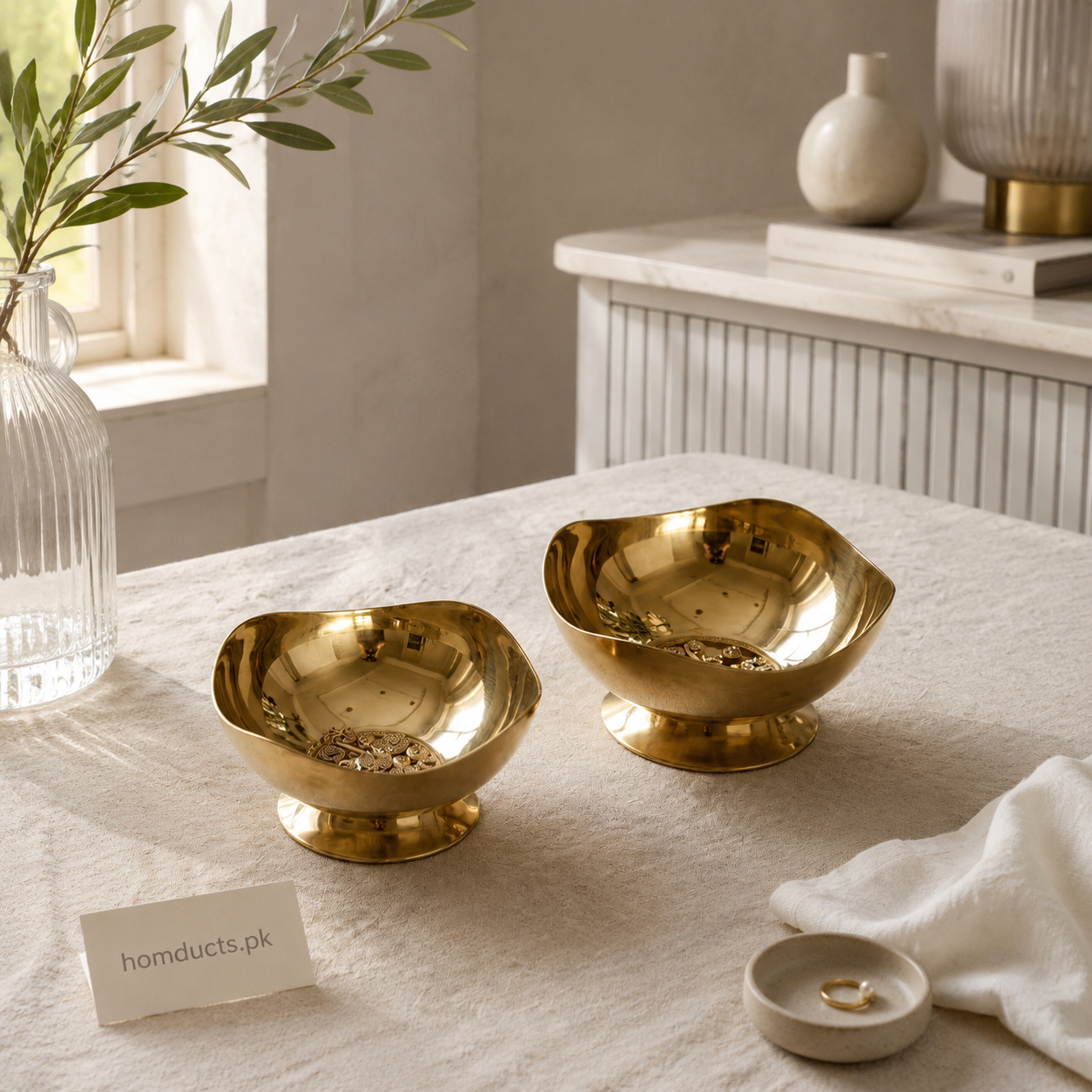 Golden stainless steel pedestal serving bowls in two sizes