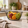 Black iron oval fruit basket with wooden base
