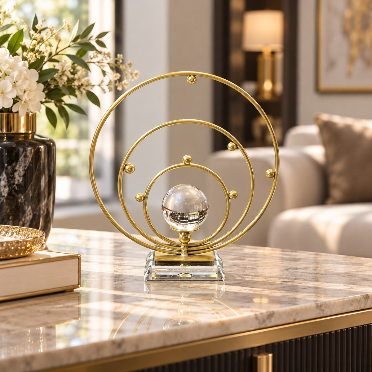 Gold concentric orbit crystal ball tabletop ornament