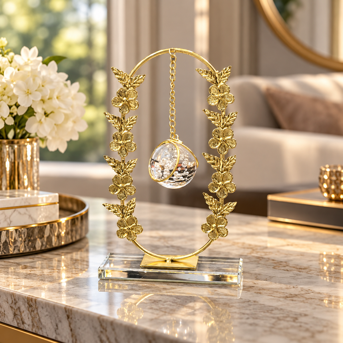 Gold oval floral frame with hanging crystal ball