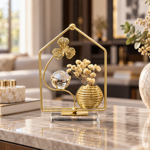 Gold floral vase and crystal ball tabletop ornament