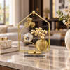 Gold floral vase and crystal ball tabletop ornament
