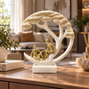 Cream and gold couple under tree sculpture