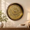 Heritage Momentum antique gold 15-inch wall clock displayed in an elegant living room