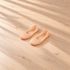 One pair of peach-coloured low-cut perforated silicone socks