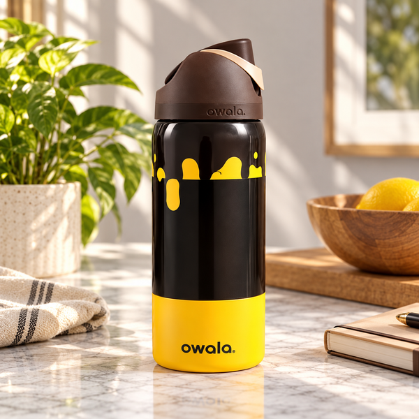 Owala Insulated Steel Water Bottle – Black and Yellow Drip – lifestyle