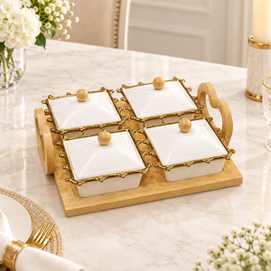 Four covered ceramic serving bowls on bamboo tray
