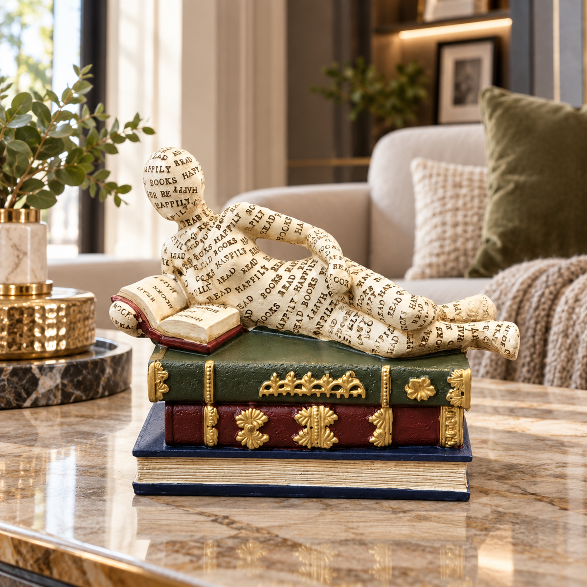 Ivory reclining reader on books sculpture