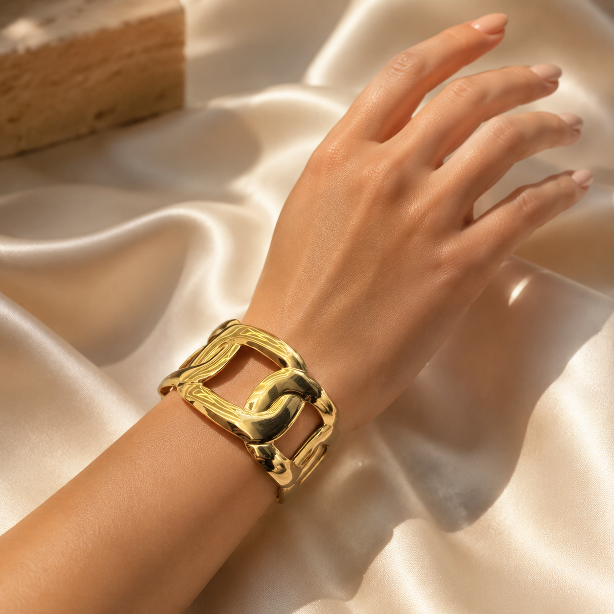 Luxury Gold Open-Link Statement Bracelet worn on an elegant feminine wrist