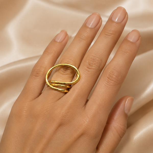 Luxury organic loop gold adjustable ring on female model hand