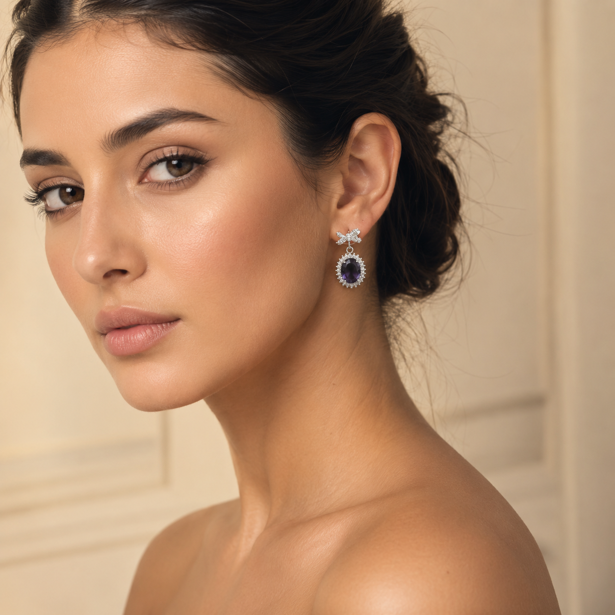 Luxury purple bow oval crystal drop earrings worn by a female model