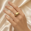 Luxury sculptural gold dome adjustable ring on female model hand