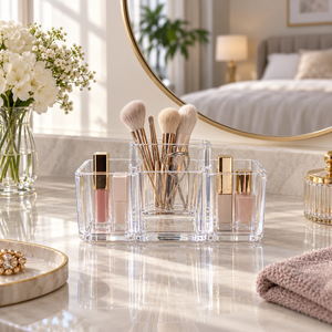 Clear acrylic multi-compartment organizer on a luxury vanity