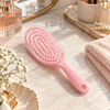 Mini vented detangling hair brush in pastel pink