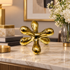 Gold Abstract Ceramic Sculpture Showpiece styled in a premium home setting