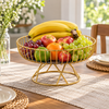 Elevated gold metal fruit basket