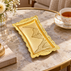 Ornate gold rectangular flowing leaf tray