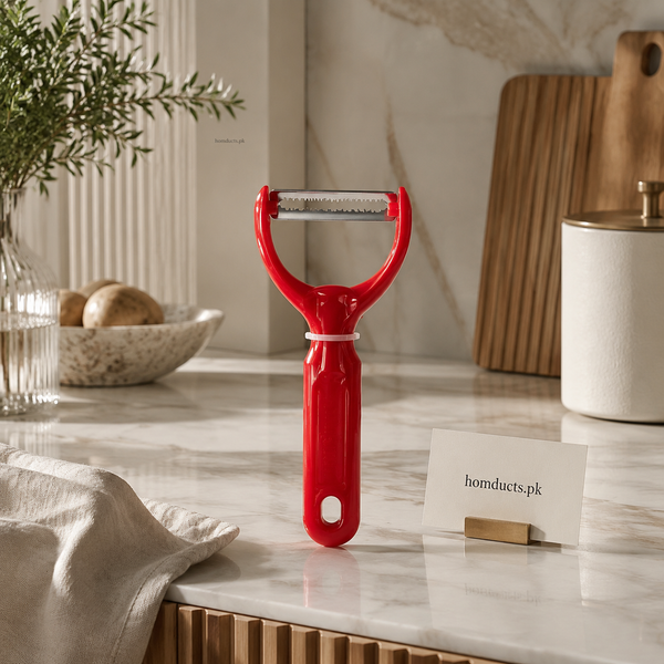 Red serrated Y shaped vegetable peeler