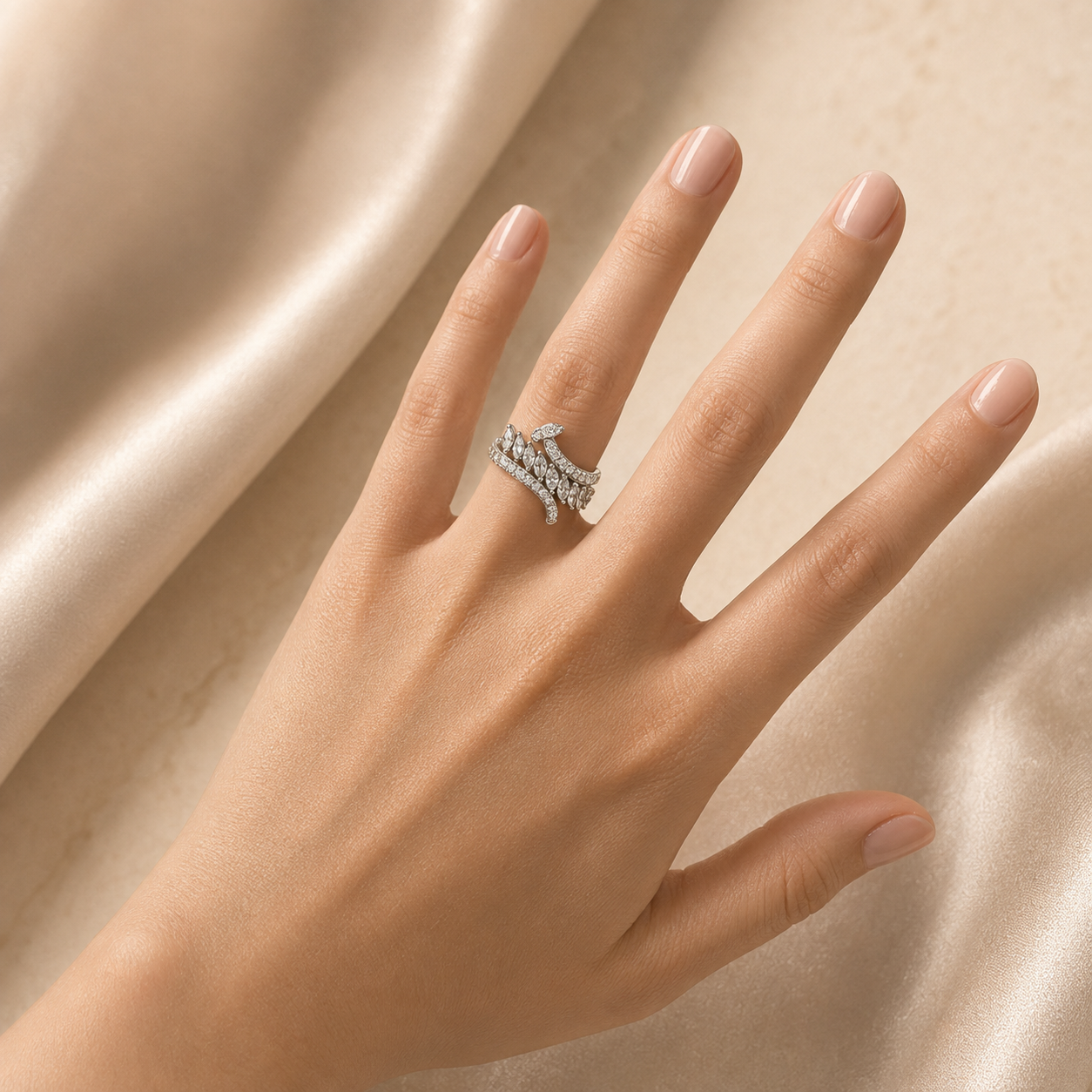 Silver leaf vine crystal statement ring on female model hand