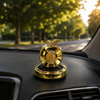 Solar-powered apple car aroma diffuser on a luxury dashboard