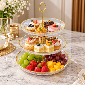 Three-tier clear acrylic serving stand with gold trim