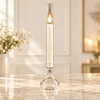 Tall ivory LED taper candle in a clear glass tube holder