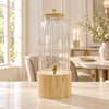 Tall ribbed glass beverage dispenser with light wooden stand
