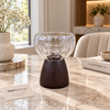 Sculptural clear glass dessert cup with dark wooden pedestal stand